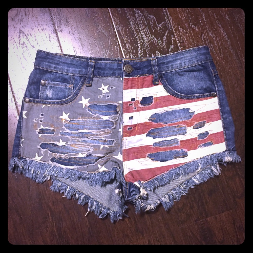 High rise distressed denim flag shorts
